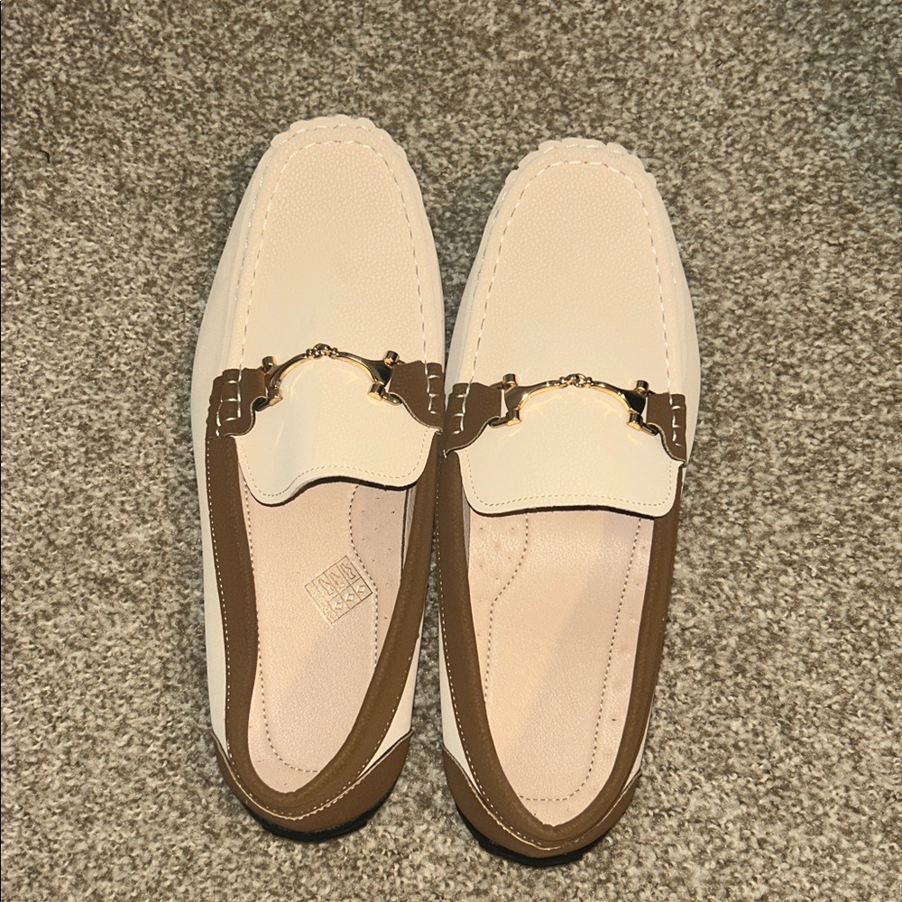 Elegant Cream Loafers with Brown Trim and Gold Detail